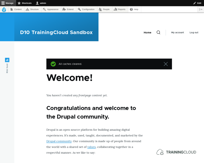 A screenshot of a Drupal 10 homepage with the 'All caches cleared' alert message showing.